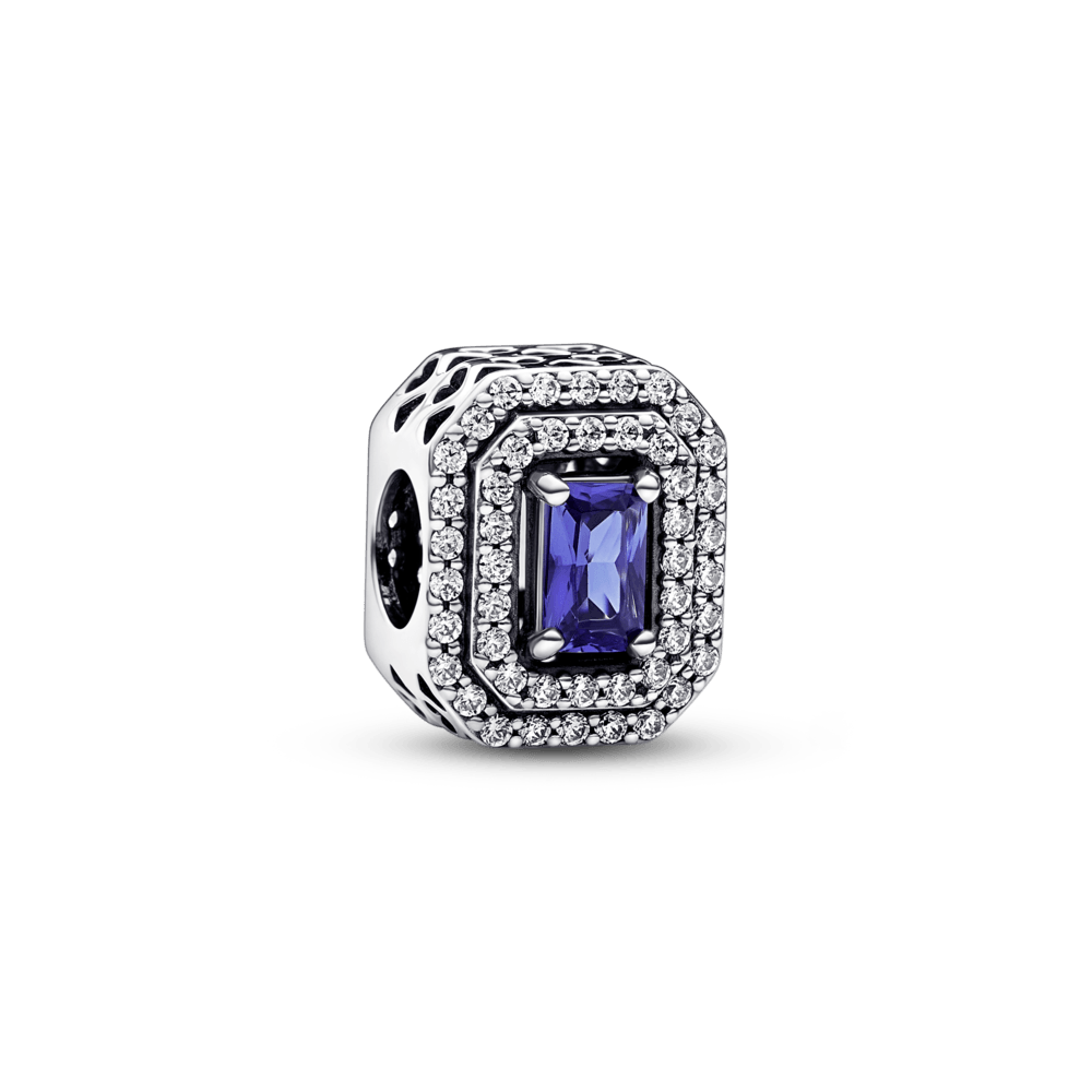 A blue sparkling square amulet with polished corners
